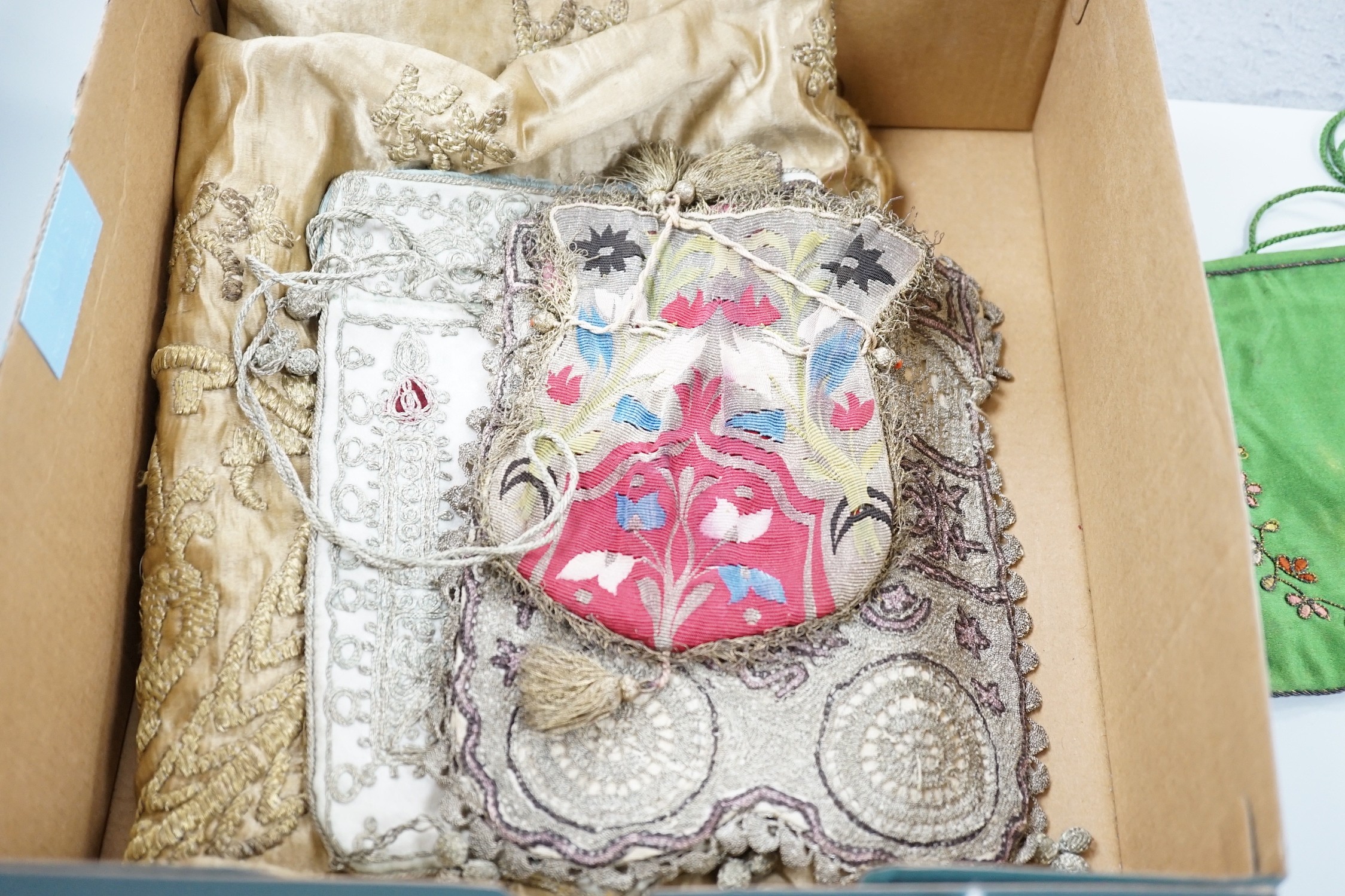 An Indian metal thread embroidered table cover and a collection of crochet, woven and embroidered bags, some with ribbon-work and cut steel and seed decoration